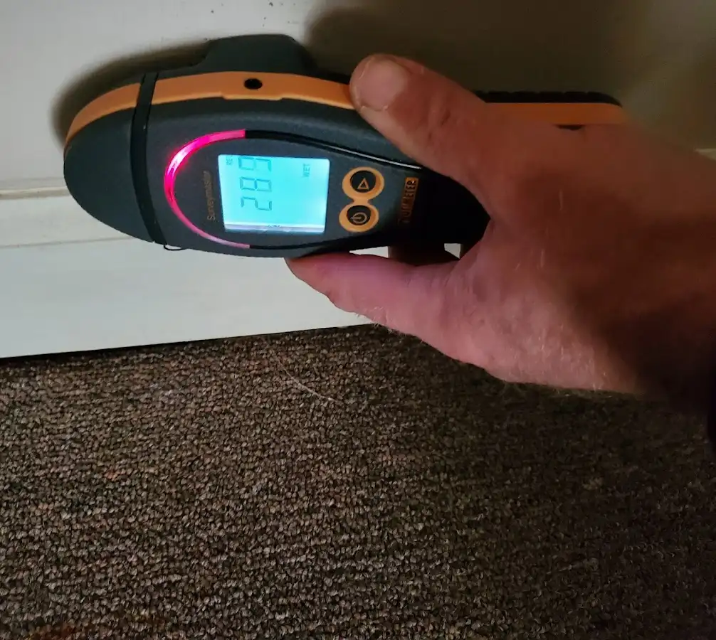 Moisture detection at baseboard during Storm Damage Restoration in Tyngsborough